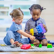 two children playing with blocks