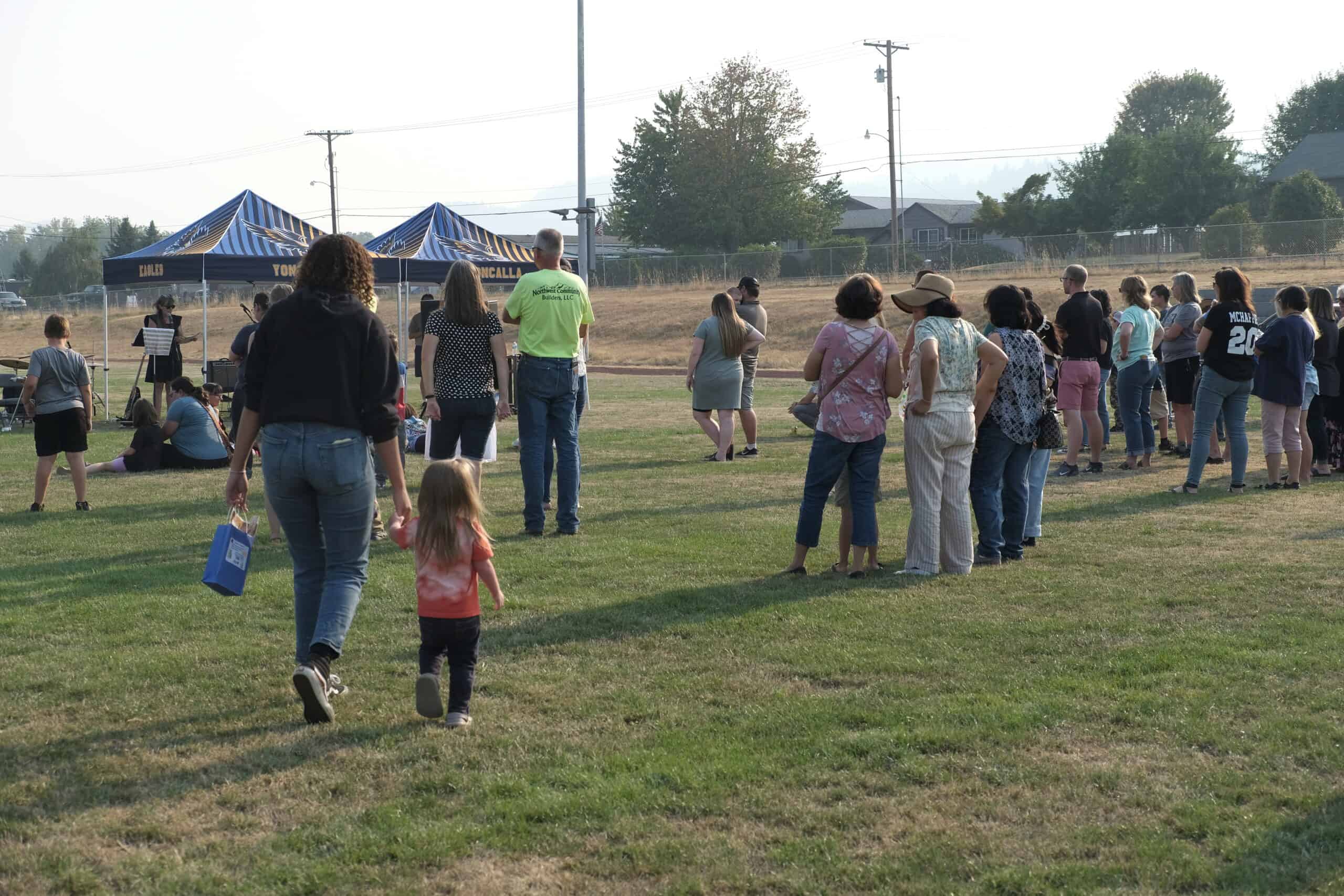 This image shows a smiling group of CI Staff members standing in a line.